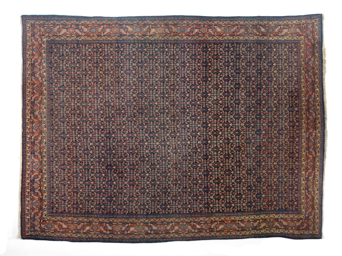 Appraisal: NORTHWEST PERSIAN CARPET EARLY TWENTIETH CENTURY The blue-black field with