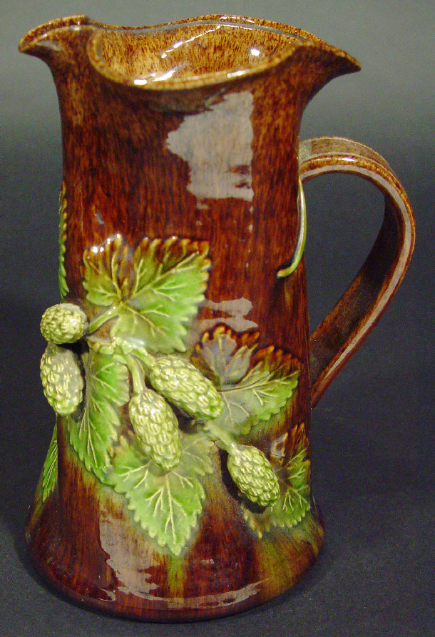 Appraisal: Rye Pottery jug of fluted form relief moulded with hops