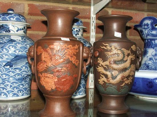 Appraisal: A PAIR OF CHINESE EARTHENWARE VASES of baluster form applied