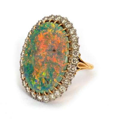 Appraisal: An opal and diamond cluster ring the large oval opal