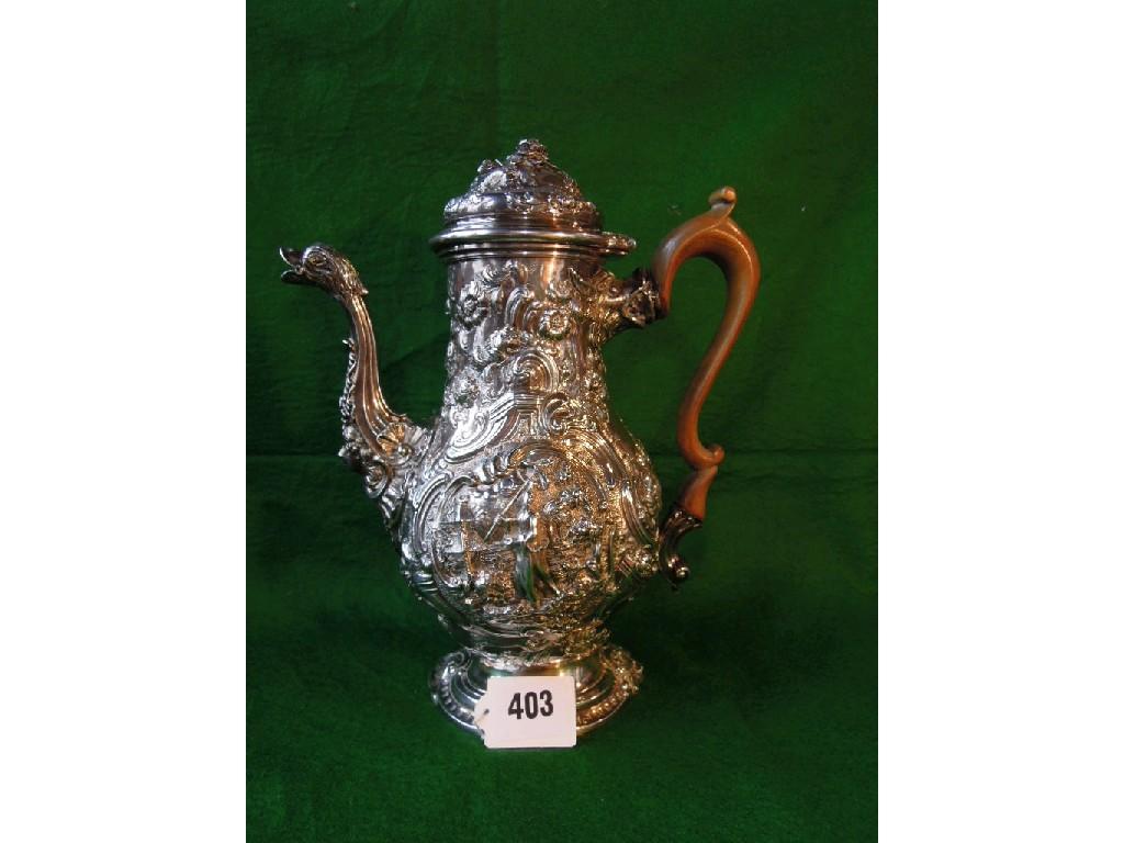 Appraisal: A heavily engraved George II coffee pot with a central