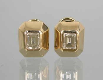 Appraisal: A Pair of Lady's Contemporary Earrings with Diamond Solitaires Each