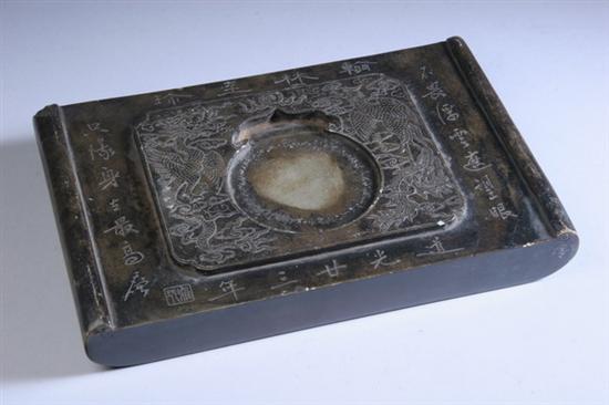 Appraisal: CHINESE GREEN DUAN INKSTONE Late Qing Carved with dragon and