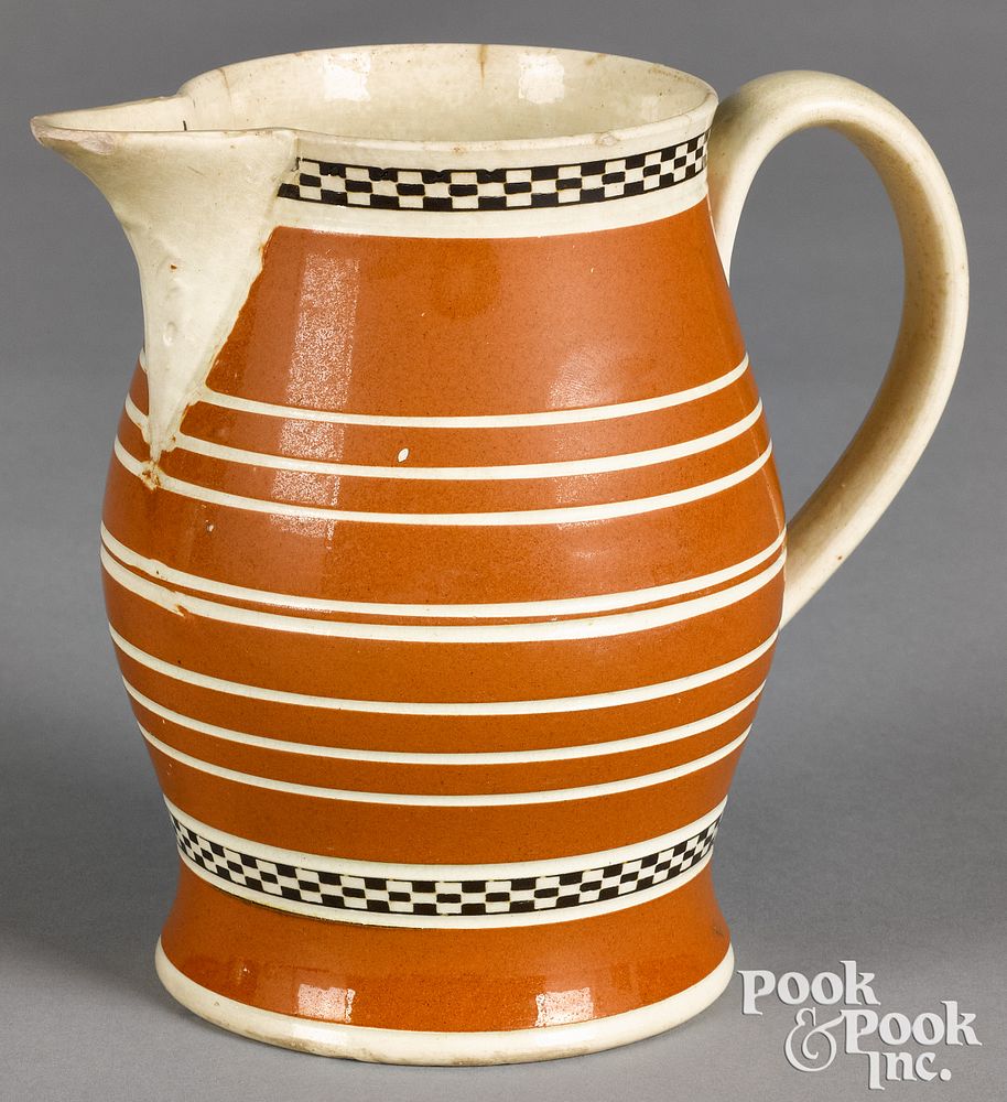 Appraisal: Mocha pitcher with orange and ivory bands Mocha pitcher with