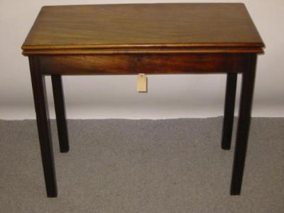 Appraisal: A GEORGE III MAHOGANY FOLDING TEA TABLE th century of