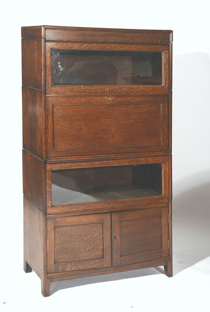 Appraisal: AN OAK STACKING BOOKCASE with two glazed shelves and two