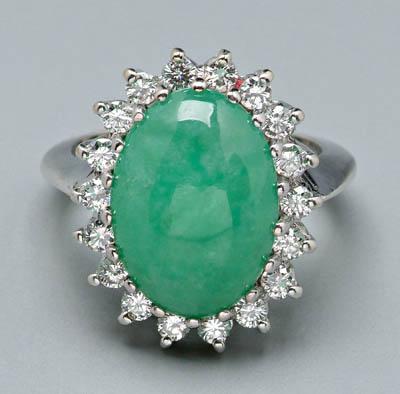 Appraisal: Lady's jade and diamond ring medium green oval jade cabochon