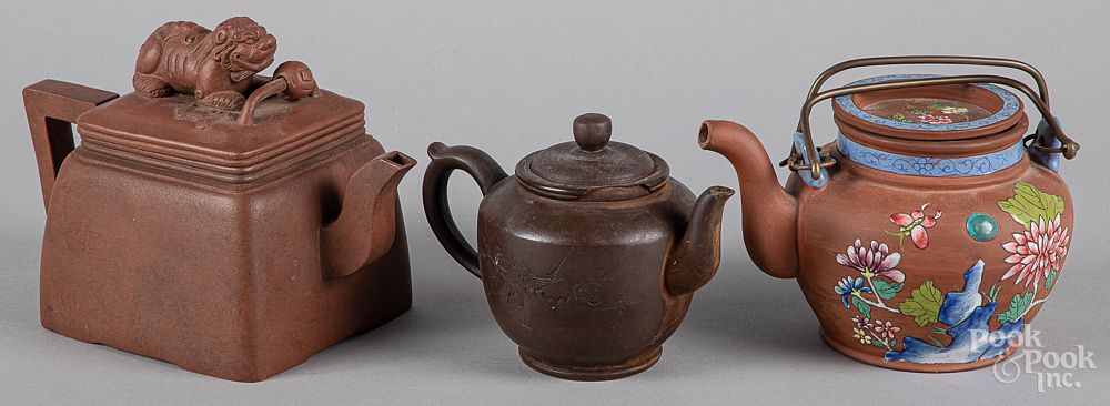 Appraisal: Three Chinese Yixing teapots Three Chinese Yixing teapots tallest -