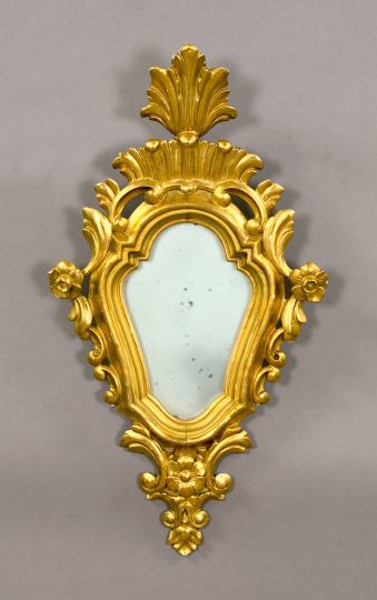 Appraisal: Italian Carved Giltwood Cartouche-Form Looking Glass third quarter th century