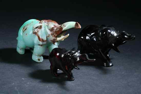 Appraisal: THREE CHINESE FIGURES OF ELEPHANTS Two amber one turquoise -