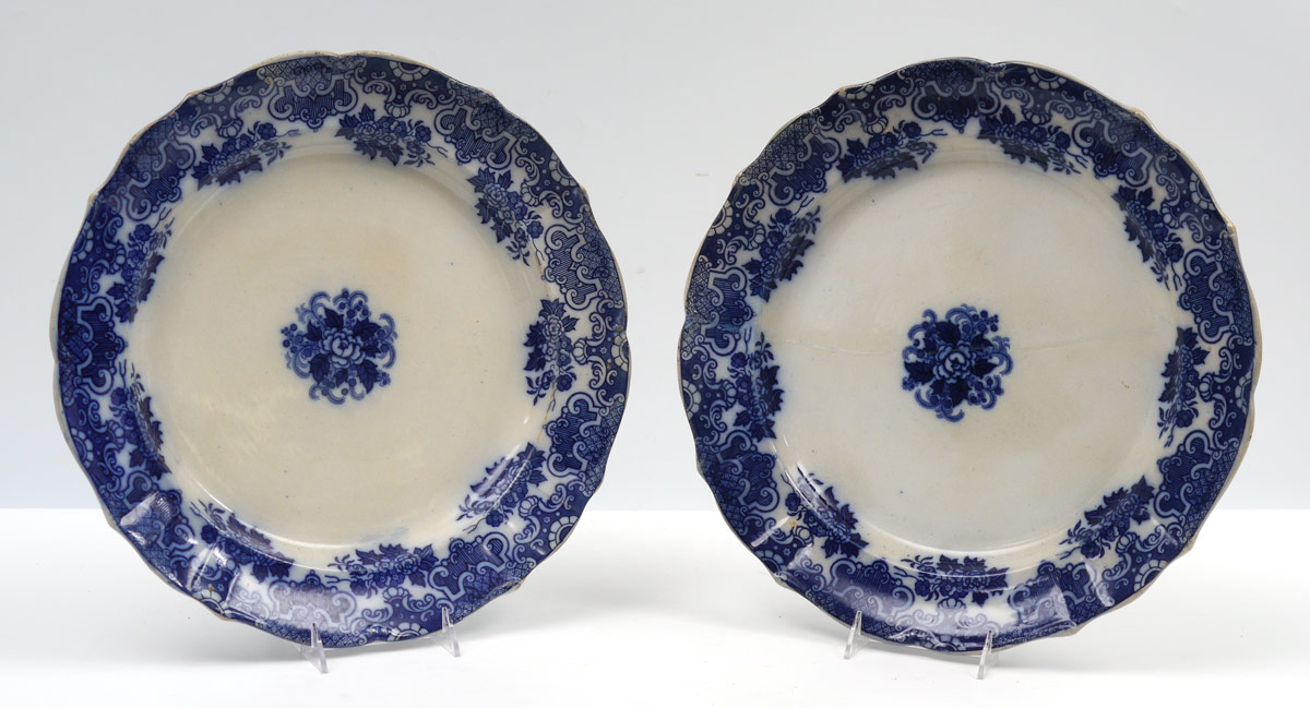 Appraisal: PAIR GUSTAFSBERG FLOW BLUE CHARGERS Matched pair with floral motifs