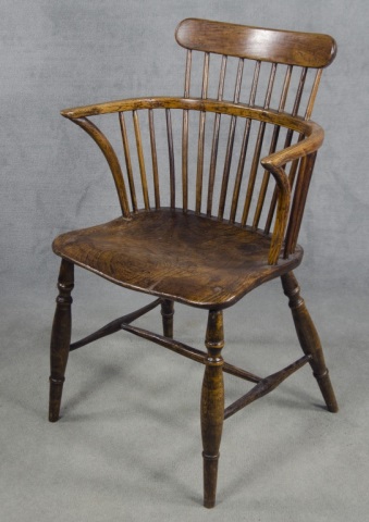 Appraisal: Comb-Back English Windsor ChairNine-spindles Yew wood scooped seat With bow