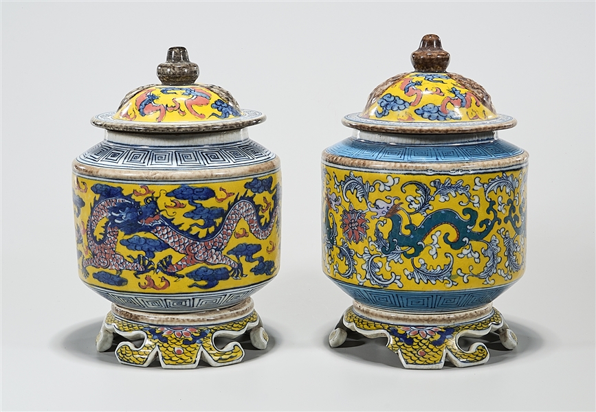 Appraisal: Two Chinese enameled porcelain covered tripod censers of dragon and