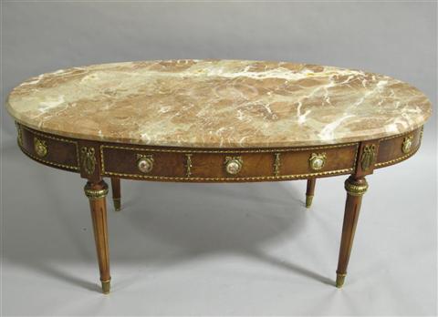 Appraisal: LOUIS XVI STYLE MARBLE COFFEE TABLE The oval marble top