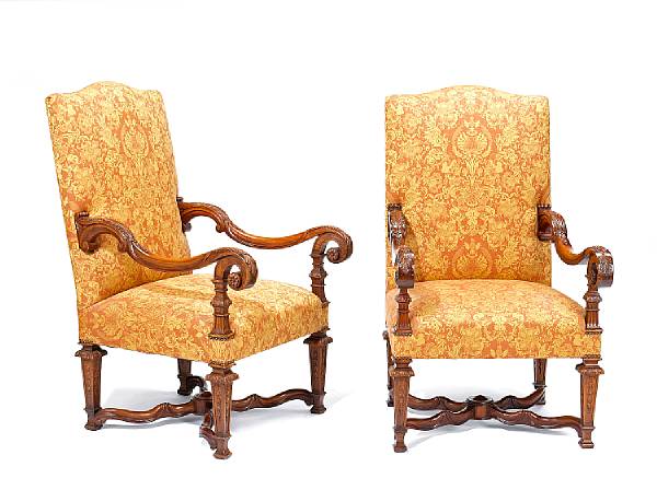 Appraisal: A pair of Louis XIV transitional style walnut fauteuils a