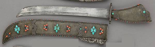 Appraisal: A silver turquoise and coral-mounted Mongolian short sword th century