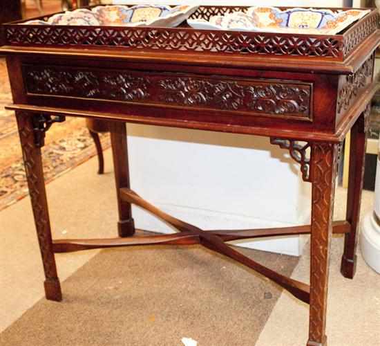 Appraisal: George II Chinese Chippendale style single-drawer reticulated silver table Estimate