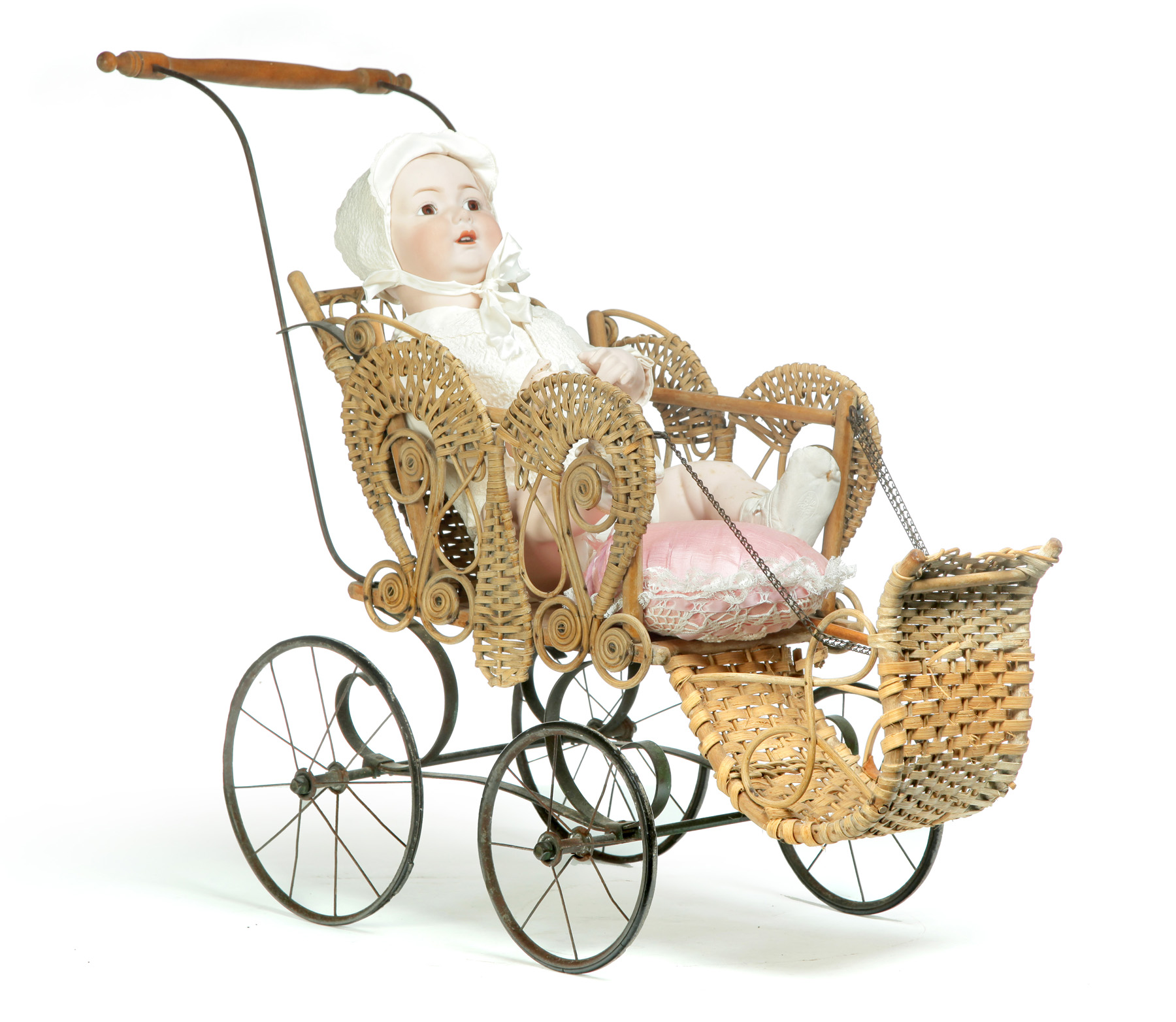 Appraisal: GERMAN BISQUE HEAD DOLL IN WICKER CARRIAGE First quarter- th