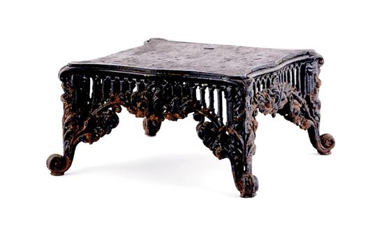 Appraisal: Cast-iron footstool late th century iron frame with rococo decoration