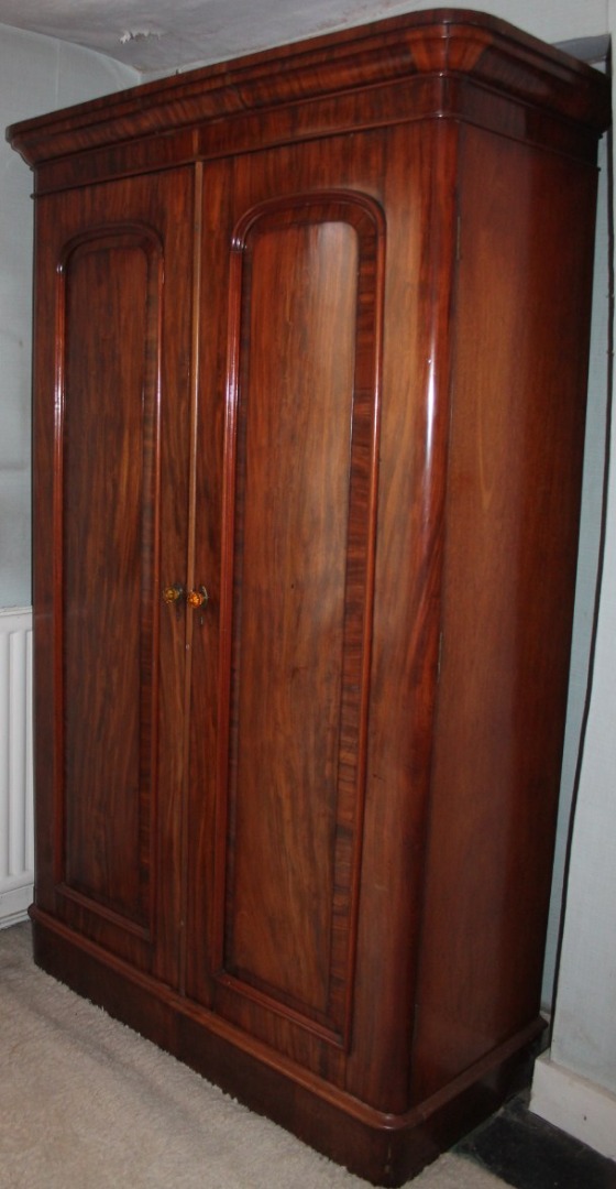 Appraisal: A Victorian mahogany two door wardrobe with moulded cornice and