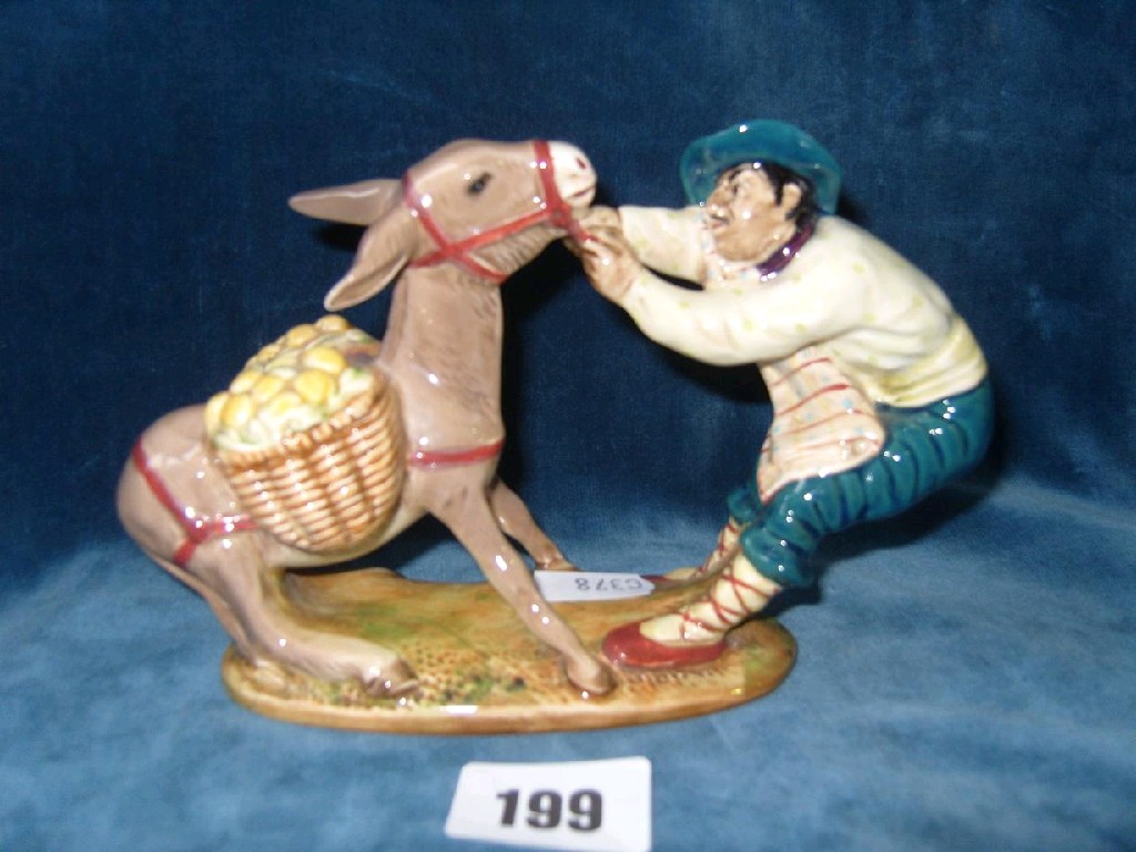 Appraisal: A Beswick model of a Spanish character pulling a donkey