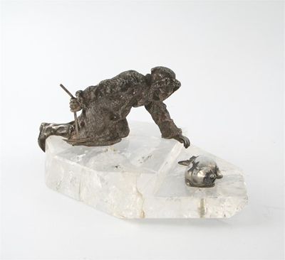 Appraisal: A Russian silver model of a seal hunter and seal