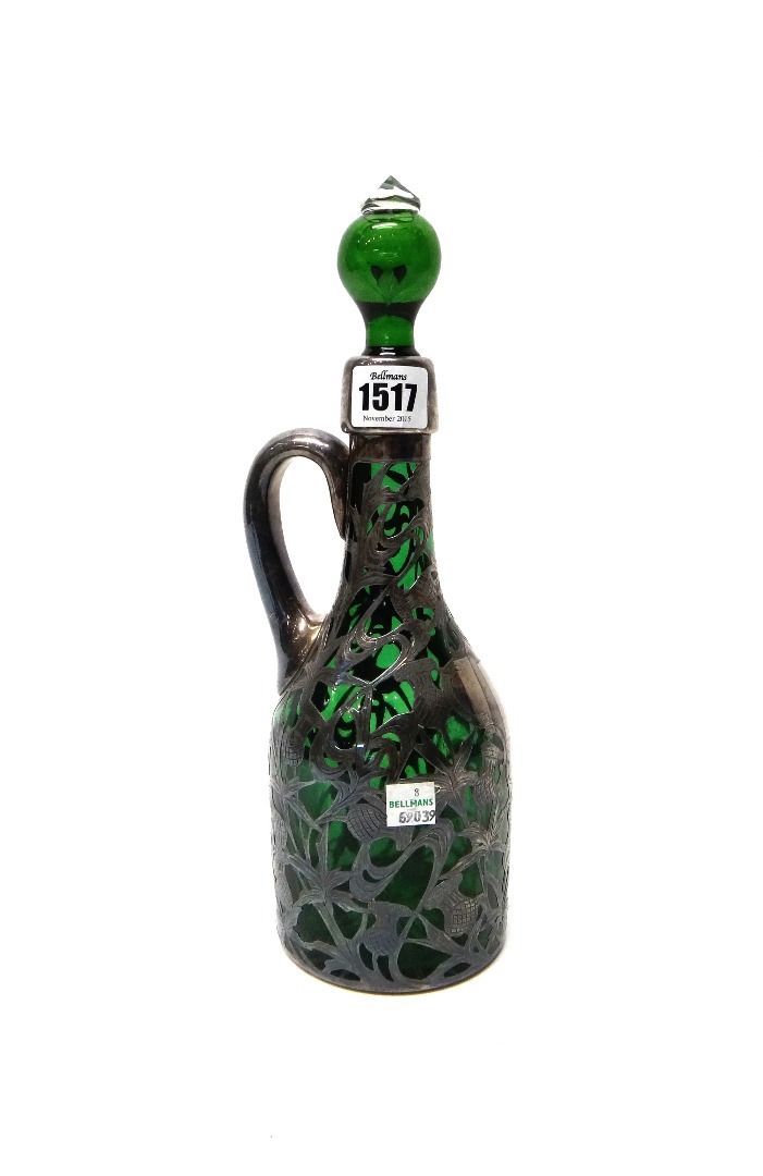 Appraisal: An American green glass claret jug circa the body decorated