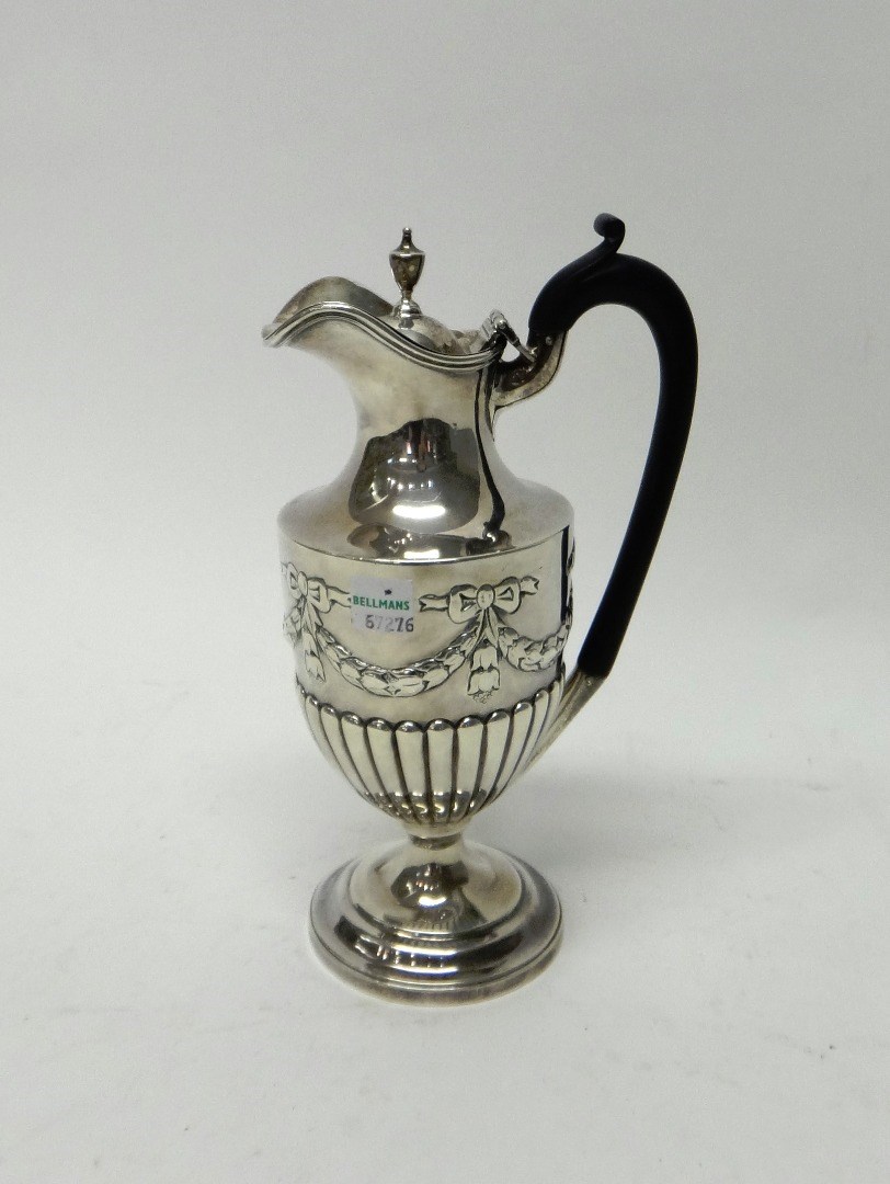 Appraisal: A late Victorian silver hot water jug of ewer form