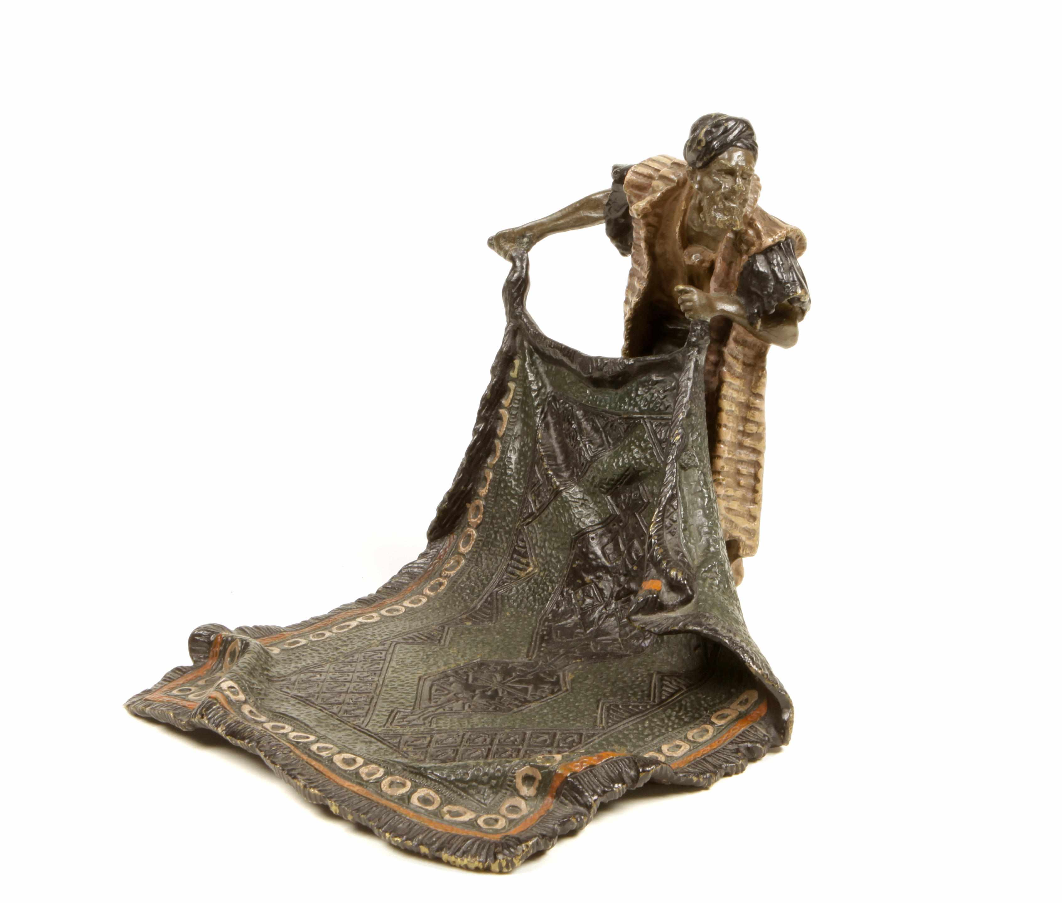 Appraisal: A cold painted bronze figure of a rug seller Bearing