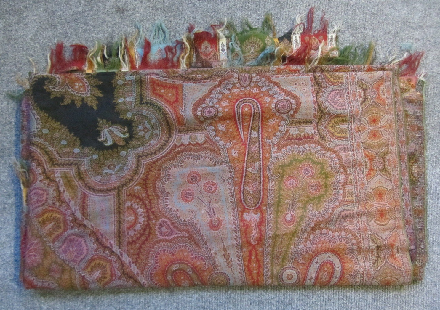 Appraisal: A Paisley shawl th century of typical design with black