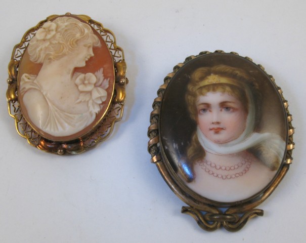 Appraisal: TWO OVAL BROOCHES one is a cameo framed in k