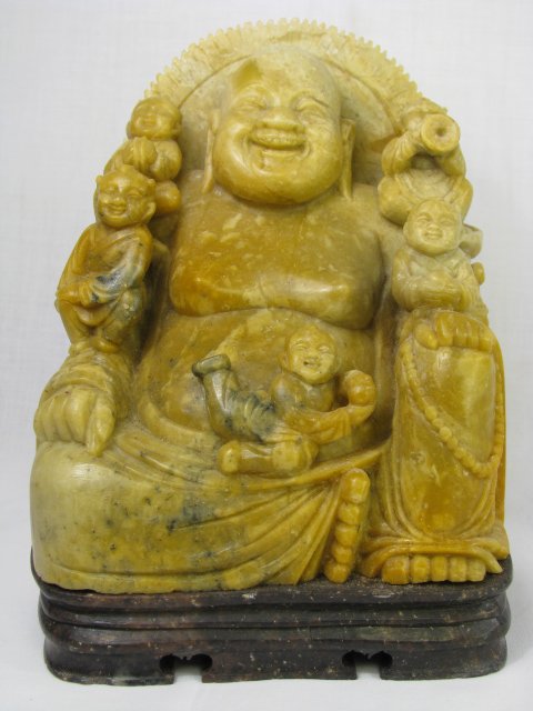 Appraisal: Twentieth century Chinese carved stone laughing Buddha sitting with five