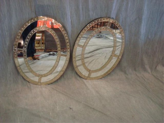 Appraisal: Pair of oval Art Deco style mirrors From a Mamaroneck