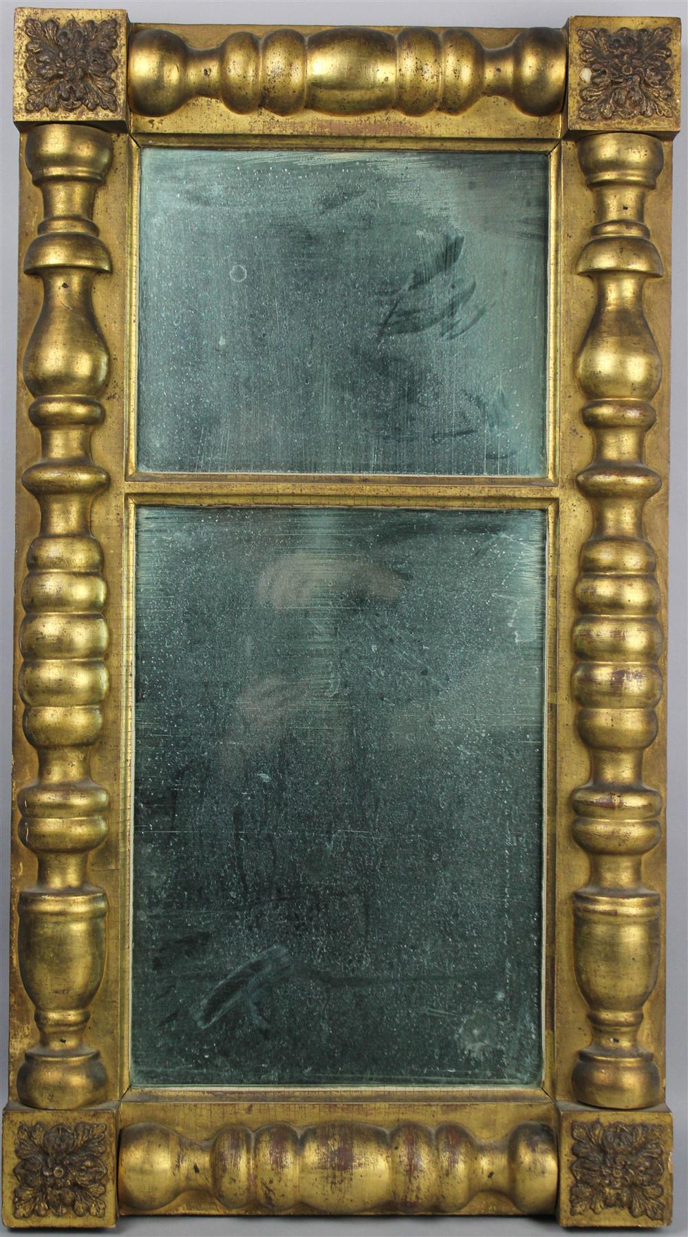 Appraisal: AMERICAN EMPIRE GILT MIRROR with columnar design and corner blocks