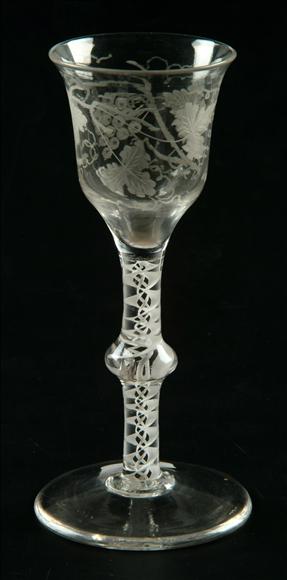 Appraisal: An engraved opaque-twist wine glass the ogee bowl with flared