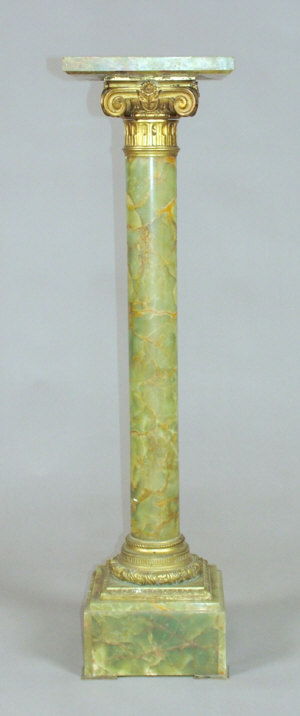 Appraisal: A variegated green onyx pedestal of columnar form with gilt