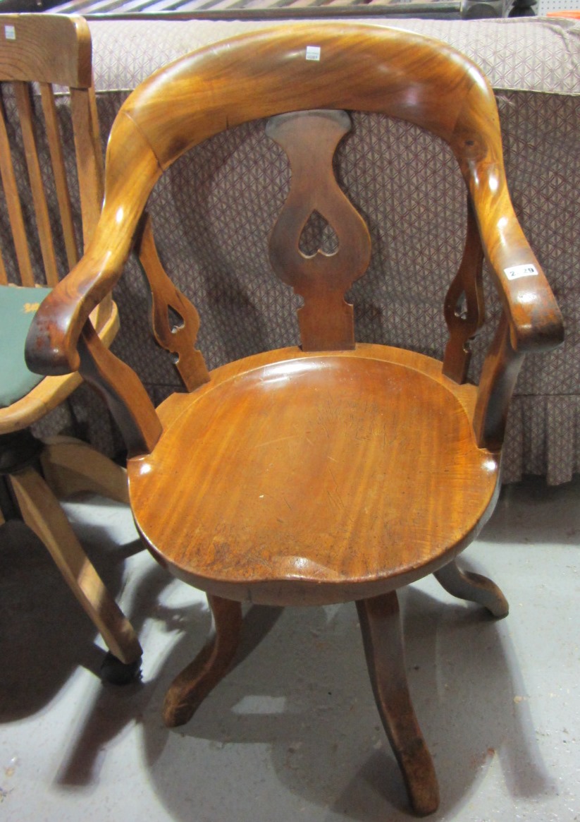 Appraisal: A th century mahogany office swivel chair