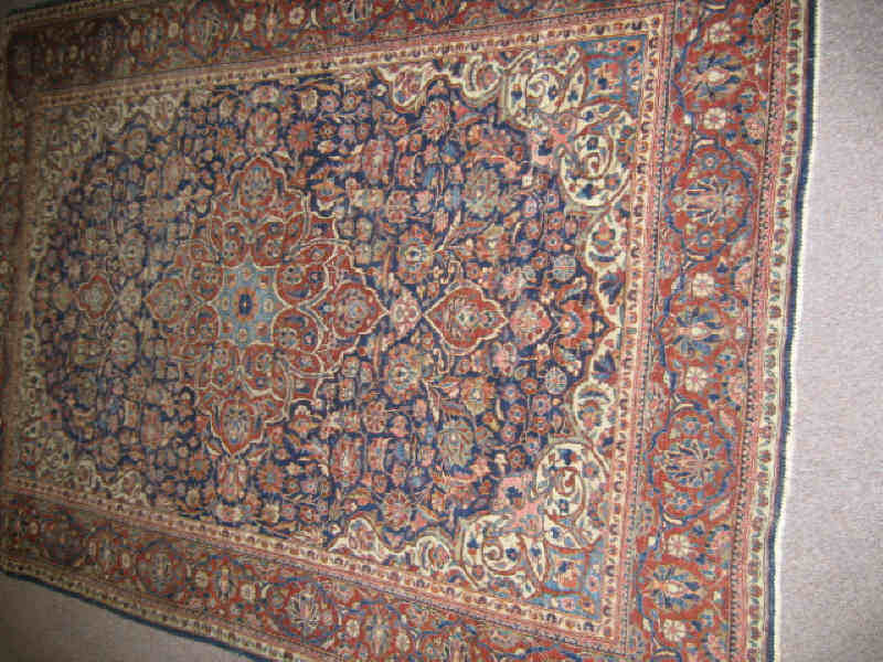 Appraisal: PERSIAN KASHAN AREA RUG The indigo field of intricate curvilinear