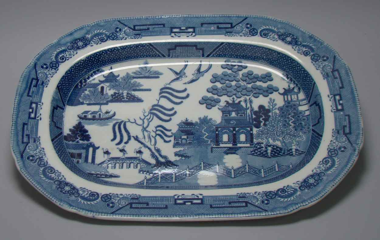 Appraisal: BLUE AND WHITE STAFFORDSHIRE PLATTER Mid- th CenturyWith Oriental scenic