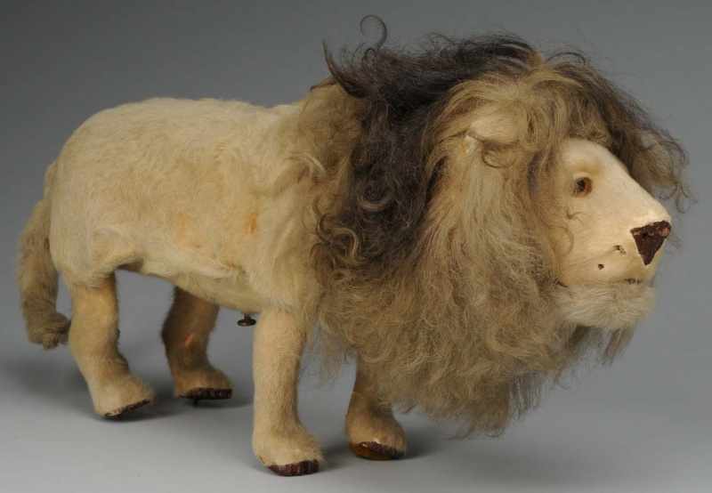 Appraisal: Fur-Covered Decamps Lion Clockwork Toy Description French Not working Glass