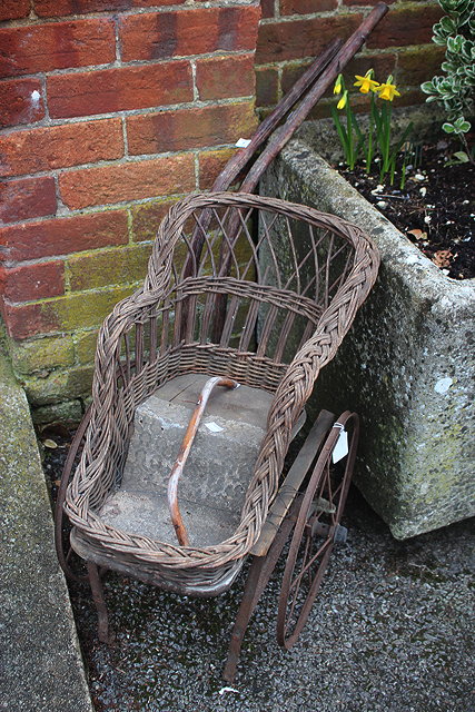 Appraisal: A VICTORIAN WICKER CHILD'S CHAIR on wheels cm wide