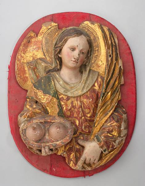 Appraisal: An Italian polychrome and giltwood panel St Agatha th century