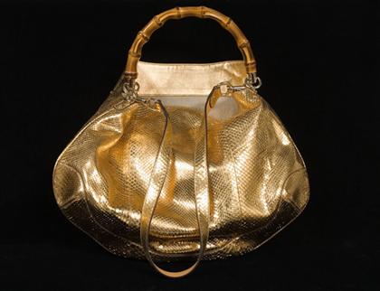 Appraisal: Gold python Gucci hobo purse contemporary Large rose-gold hobo style