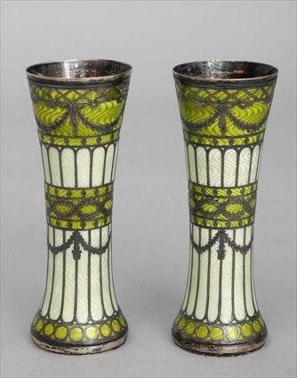 Appraisal: PAIR OF CONTINENTAL ENAMEL-MOUNTED SILVER BEAKER-FORM BUD VASE With engine