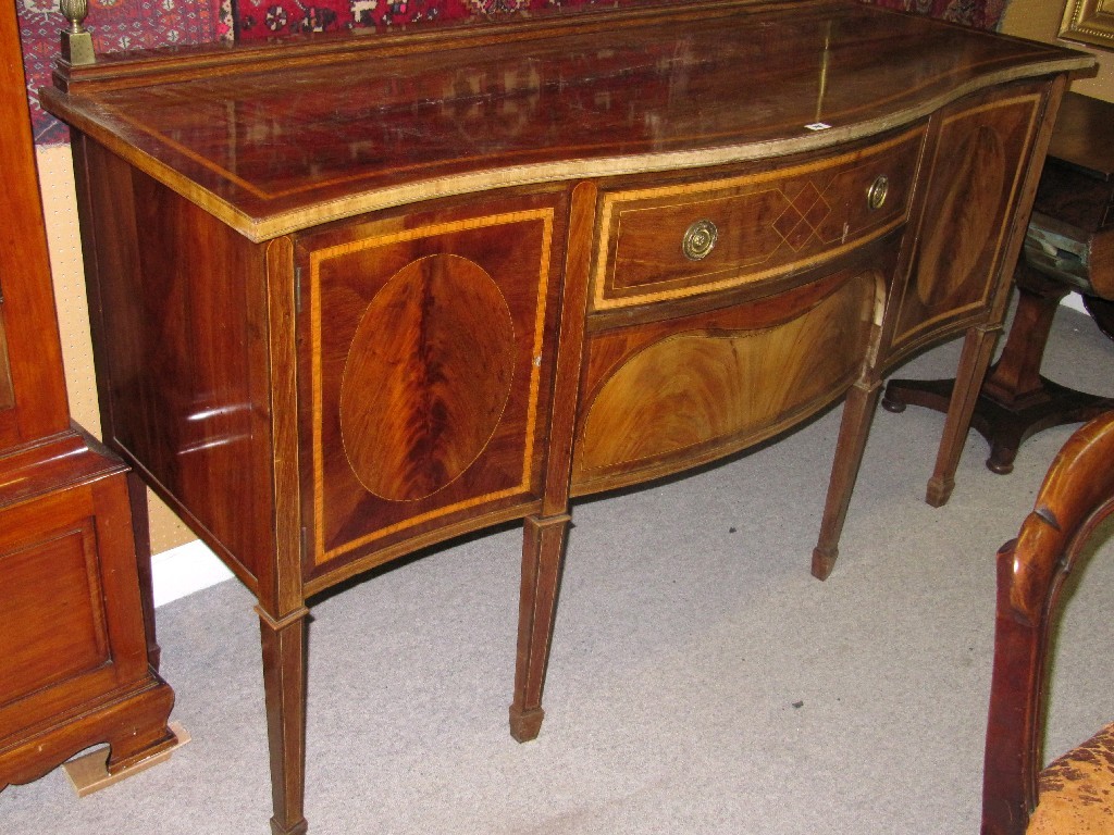 Appraisal: Edwardian mahogany and crossbanded serpentine front sideboard with brass splash