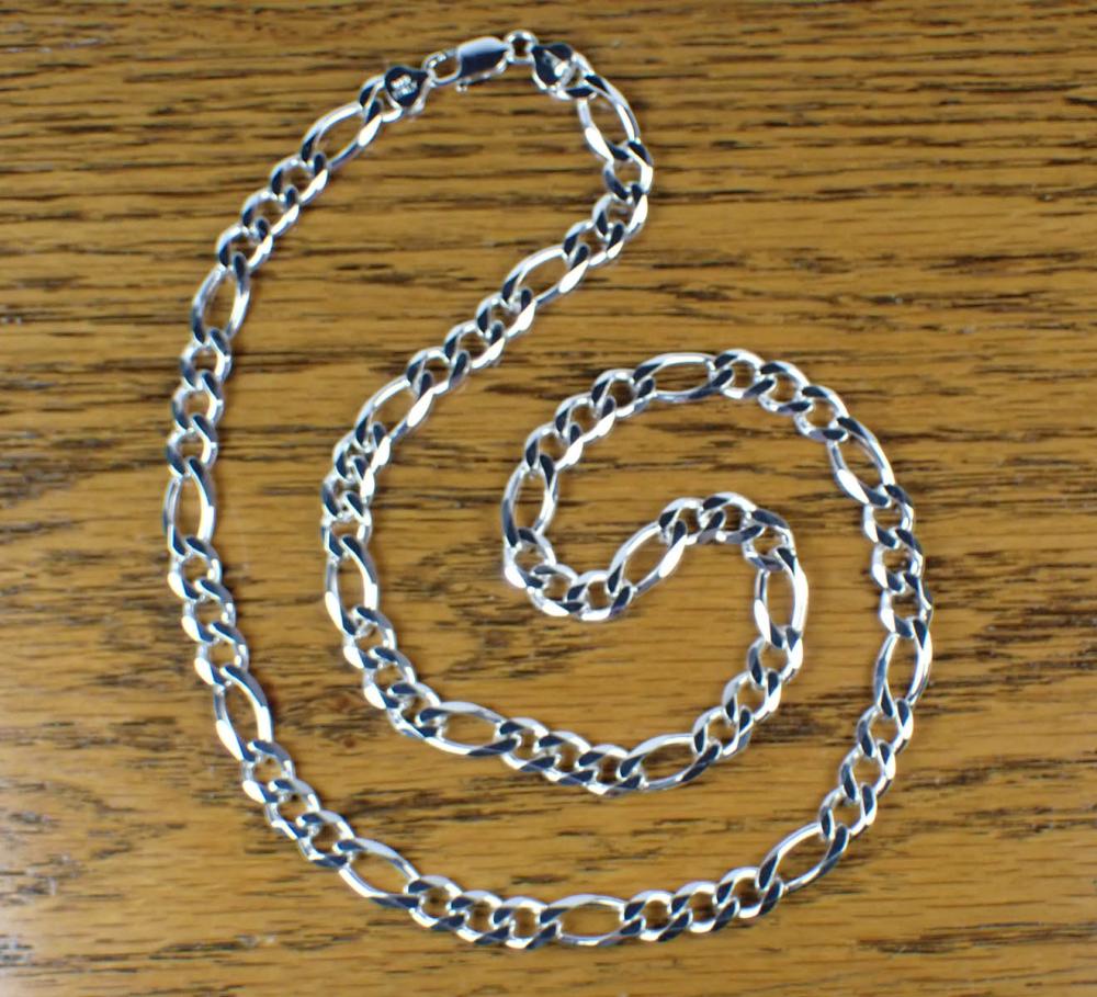 Appraisal: ITALIAN MADE STERLING SILVER FIGARO CHAIN the sterling silver figaro