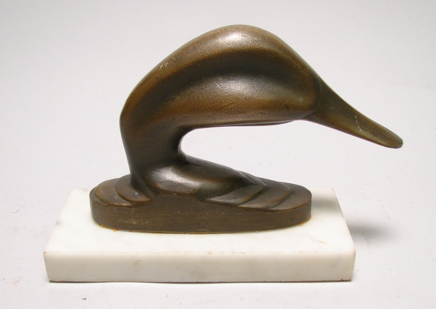 Appraisal: JOEL BARBER BRONZE DUCK HEAD Mounted on a white marble