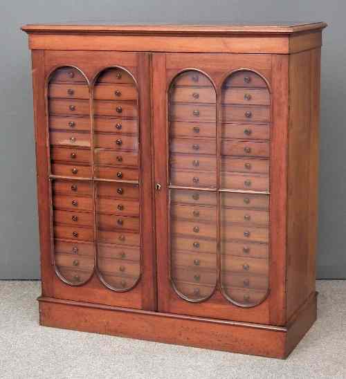 Appraisal: A Victorian mahogany collectors cabinet the top with moulded edge