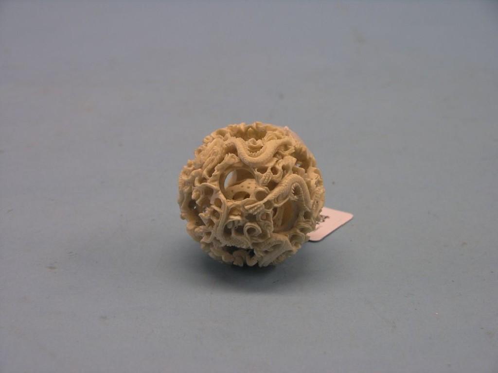 Appraisal: A Canton ivory puzzle ball approx six layers in diameter