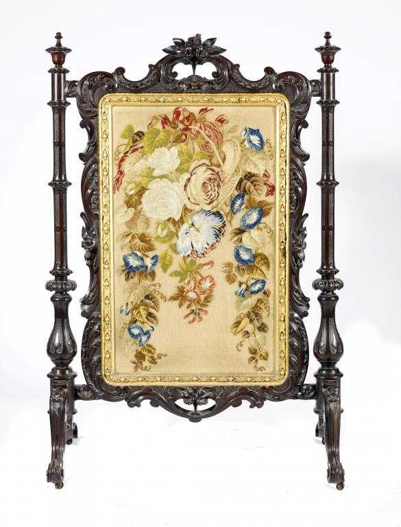 Appraisal: A VICTORIAN CARVED MAHOGANY FIRESCREEN with floral woolwork banner in